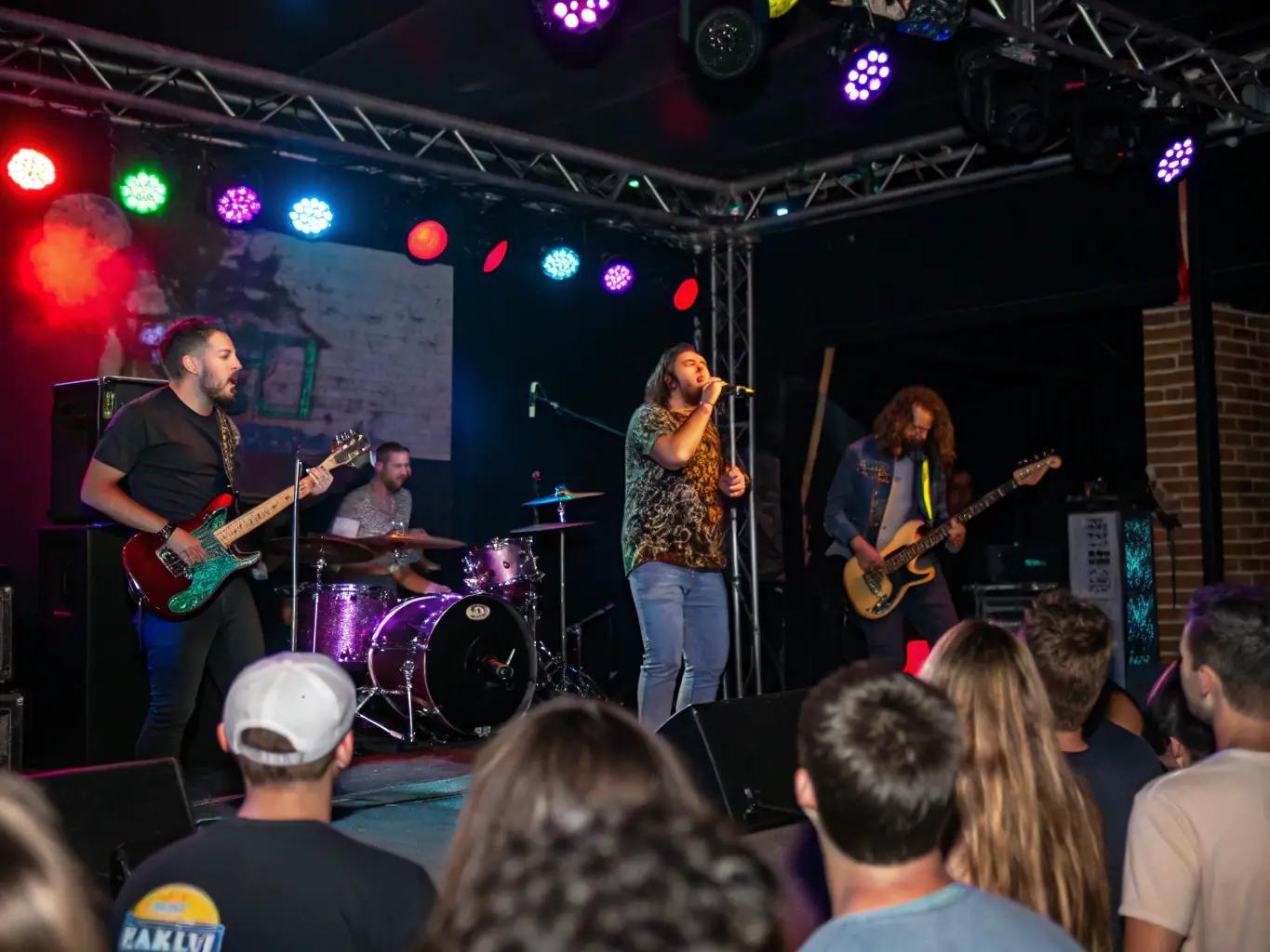 An energetic image of a live music performance with diverse artists engaging with an enthusiastic audience, capturing the vibrancy of cultural projects.